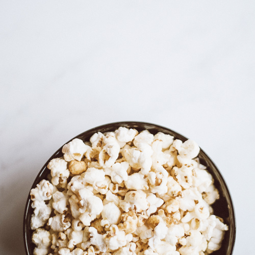 Popcorn bowl on white background