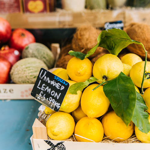 Lemons with price tag at market
