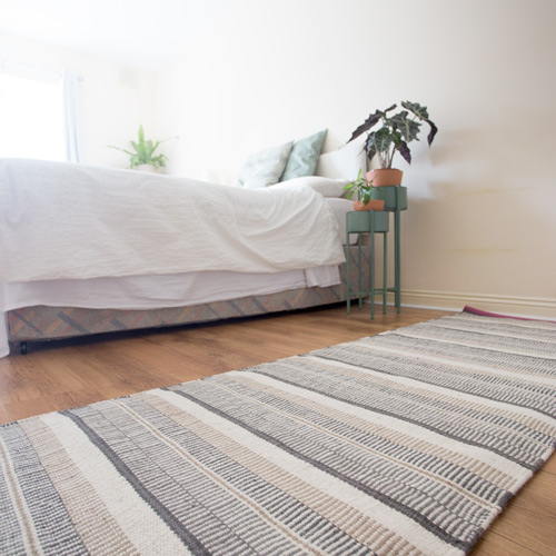 Rug over yoga mat - Sustainable & Conscious Bedroom Makeover on a budget